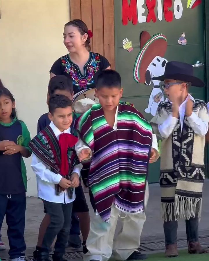 Children in sarapes and hats at the Independence Day celebration