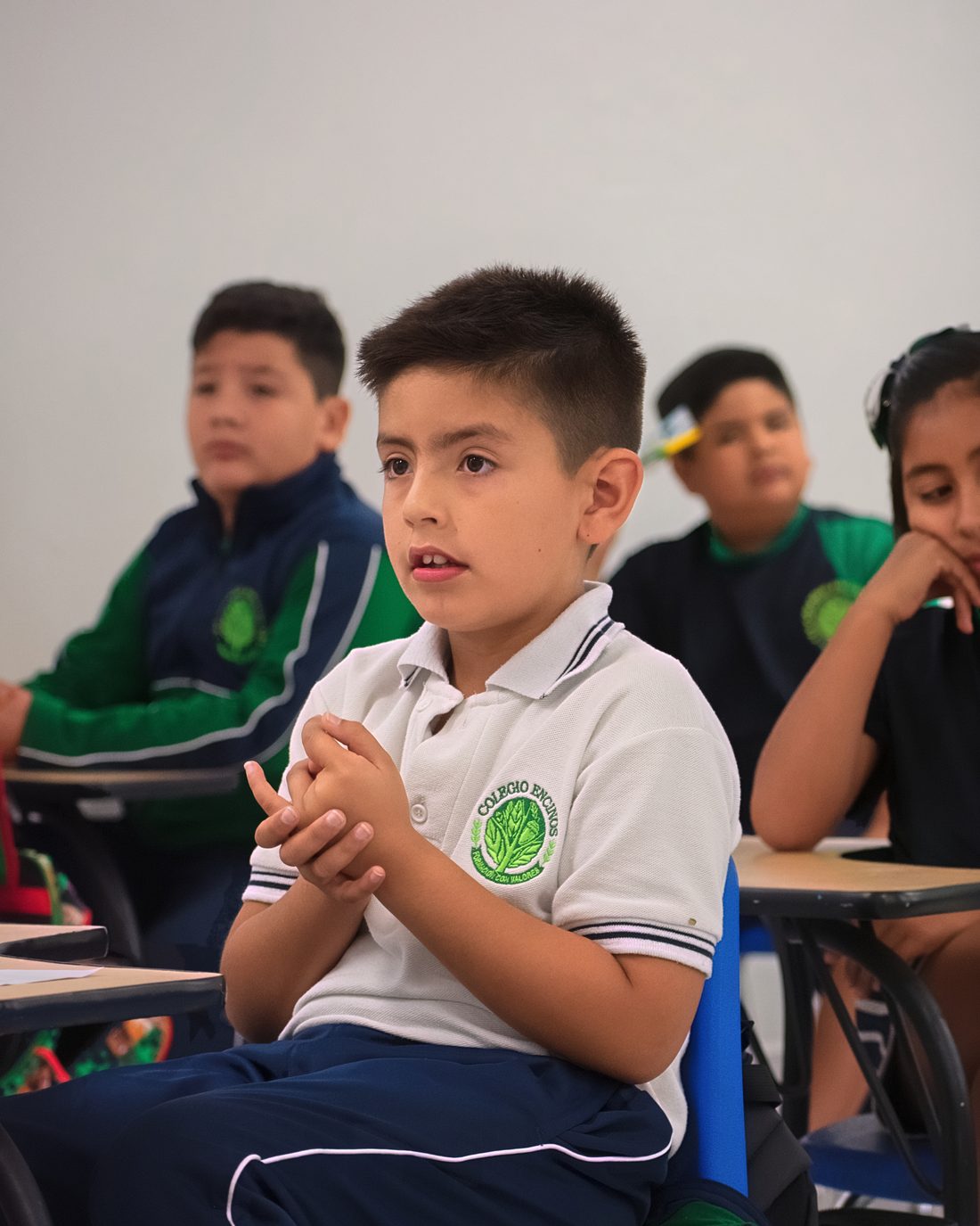Elementary student listening closely during class